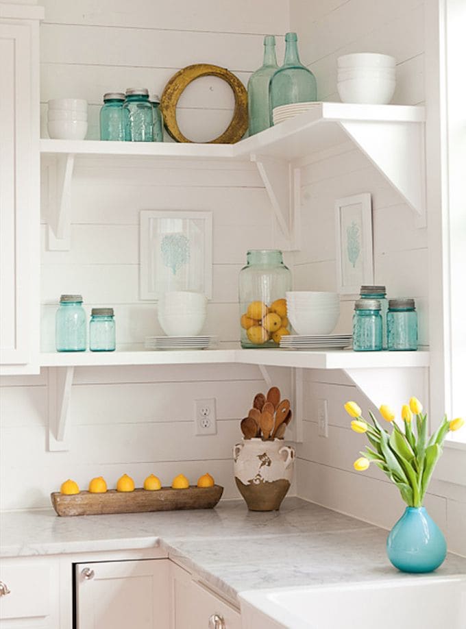 Charming White Kitchen with Vintage Glass Jars and Fresh Accents