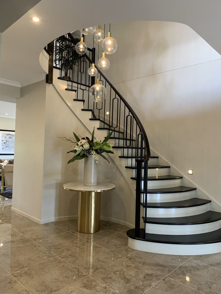 Graceful Black and White Curved Staircase