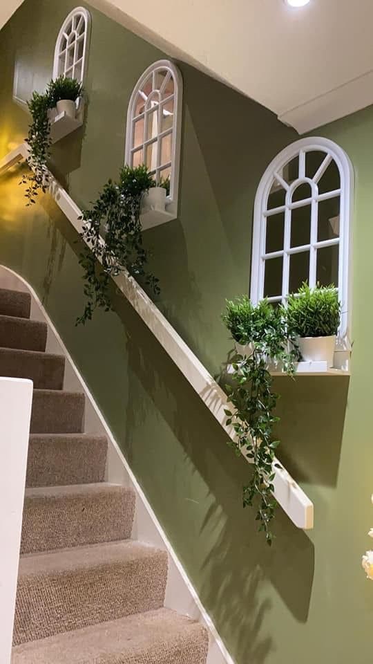 Charming Green Staircase with Elegant Wall Accents