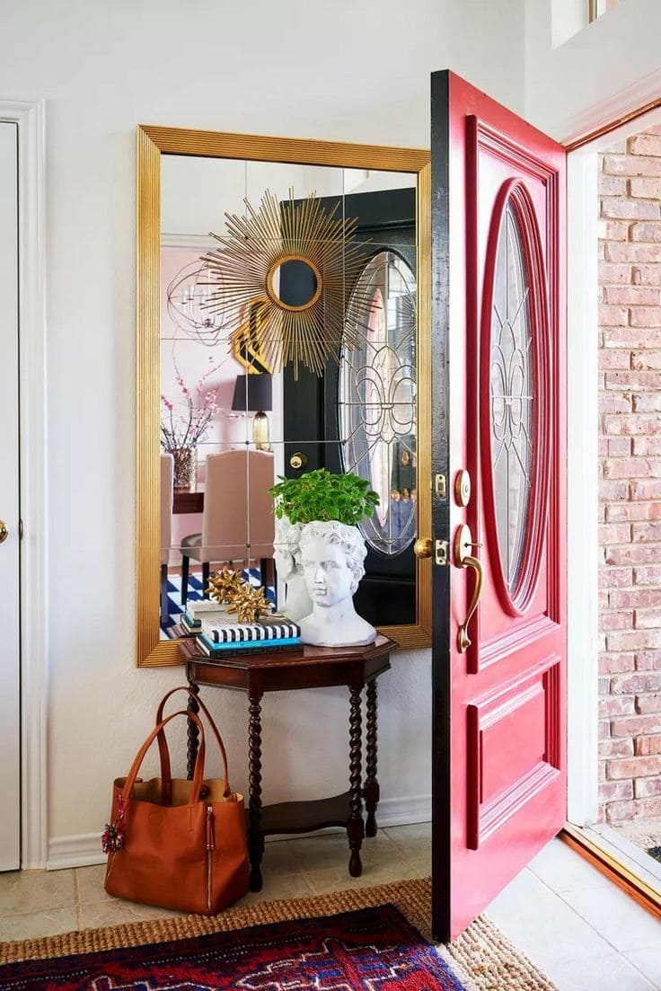 Vibrant Red Door Elegance with Golden Mirror Glow