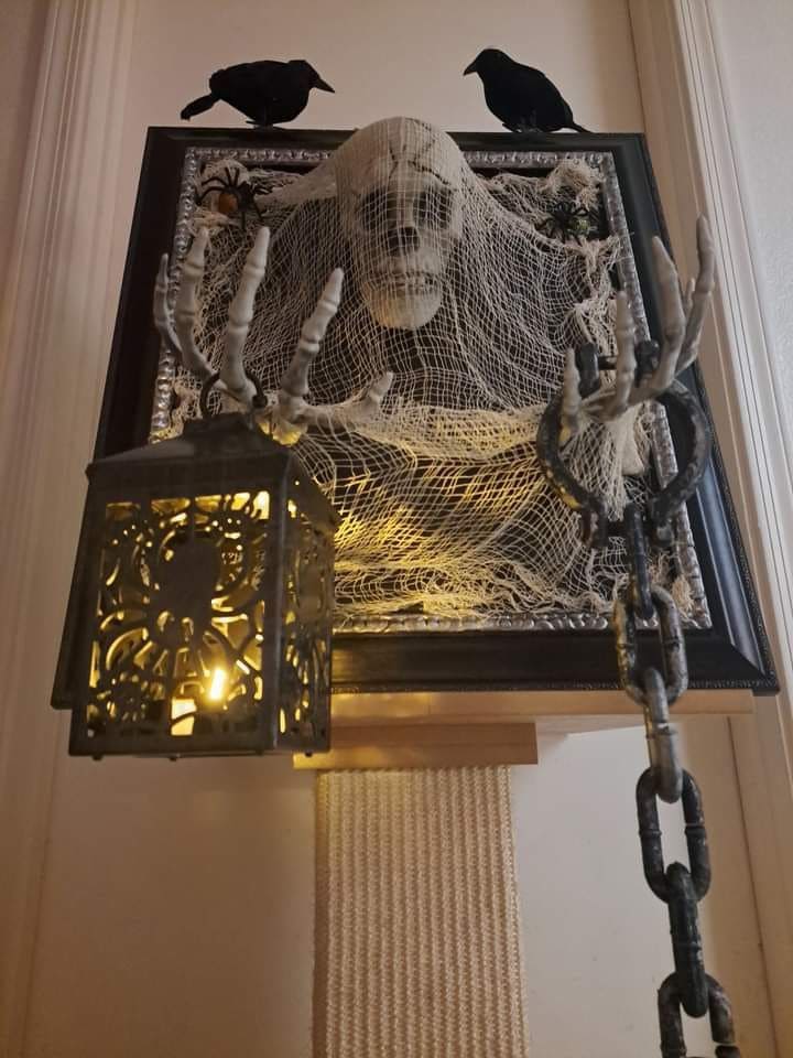 Lantern-Wielding Skeleton Wall Frame