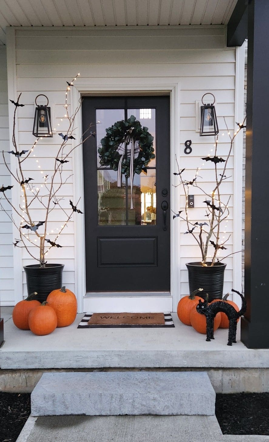 Spooky Chic Door with Bats and Bare Branches