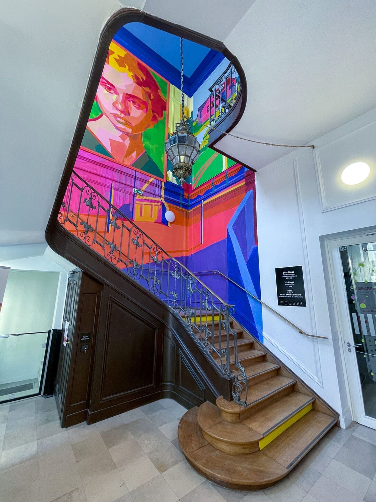 Grand Staircase With Bold Mural Art