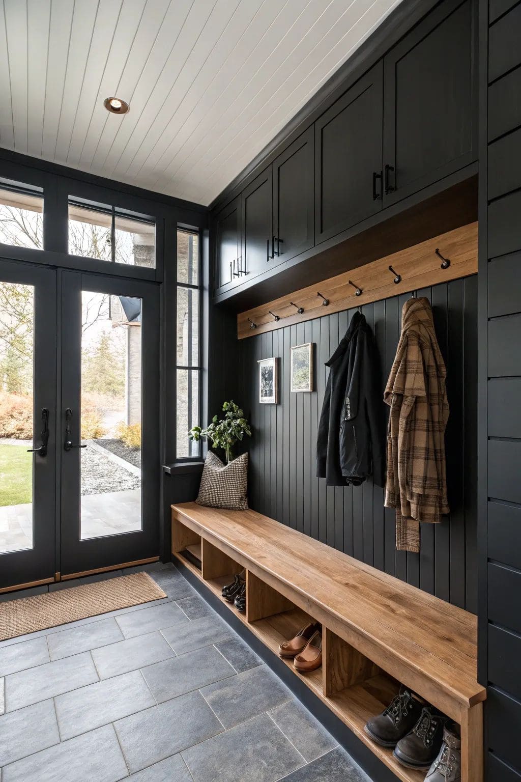 Modern Black Mudroom with Warm Wood Accents
